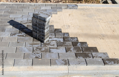 Laying paving slabs at a construction site.