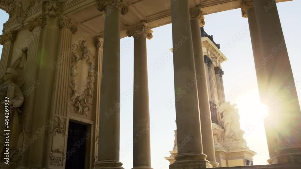 Parque del Retiro, Madrid, Spain. Alfonso XII monument, sunlight through columns. High quality 4k footage
