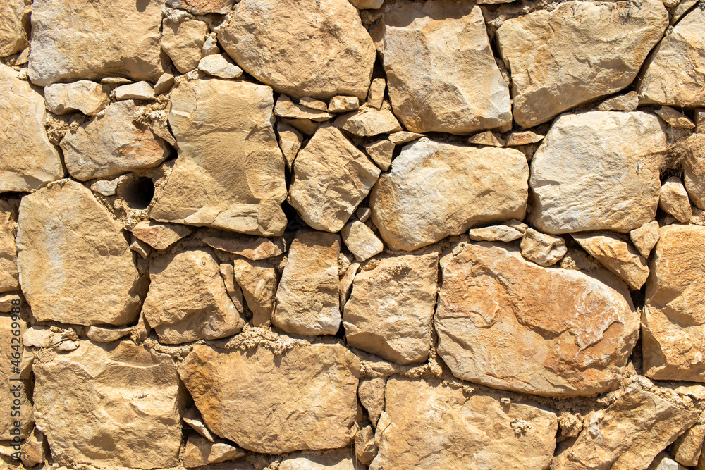 Fototapeta premium natural stone masonry building wall texture.