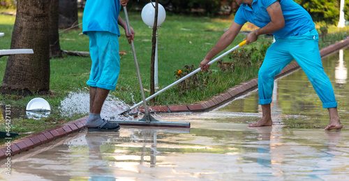 People remove water from the street