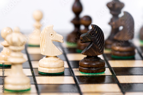 Two chess knight compete with each other, Chessboard Background, Take a strategy. Game of Chess. Game to Development Analysis Strategy Plan, Leader and Teamwork Concept for Success.Success Strategy.