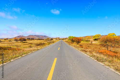 Empty asphalt road ground under blue sky. © ABCDstock