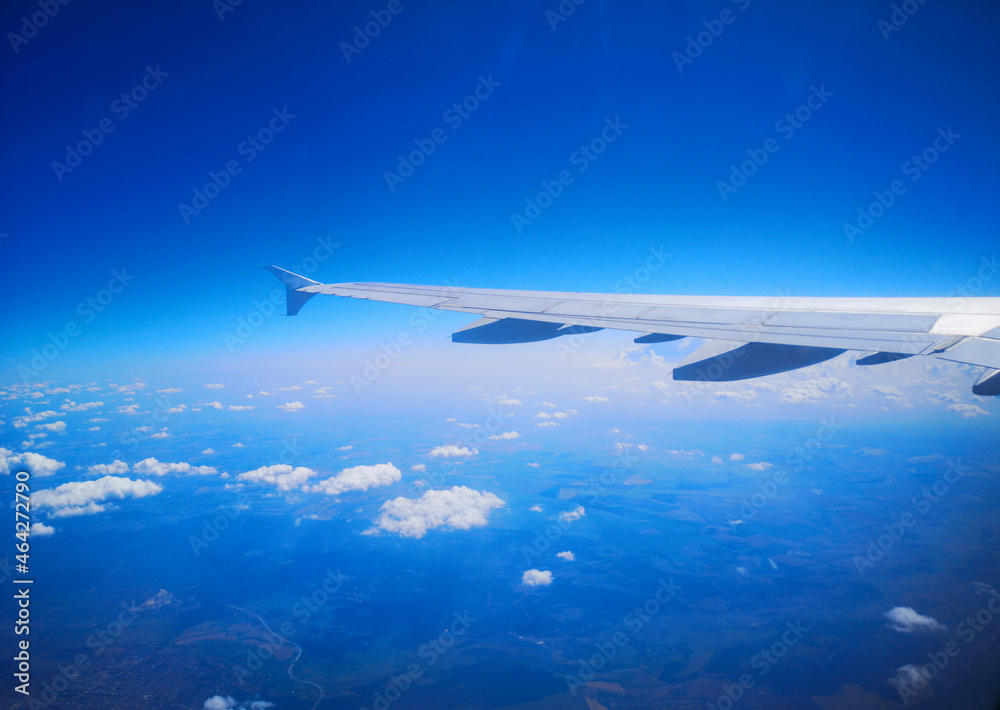 Airplane wing in sky in flight. Airplane wing in sky in flight.