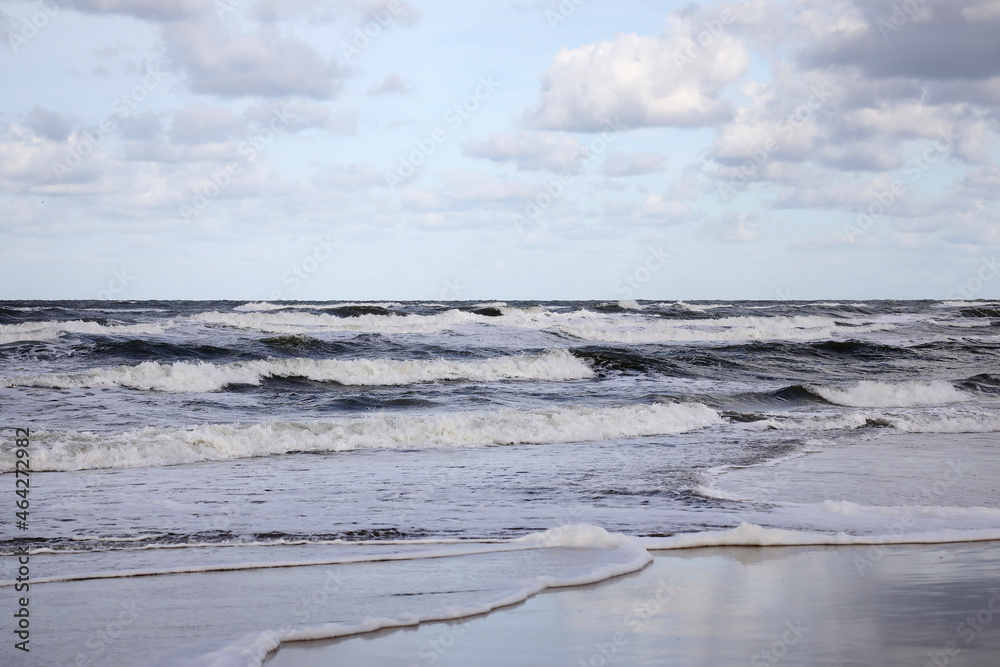 Stormy weather at the sea with clouds and waves