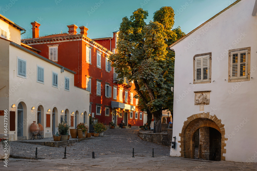 The fabulous town of Motovun on the Istrian peninsula, Croatia..The main stone square in the historic town of Motovun in the rays of the setting sun. Picturesque street Motovun