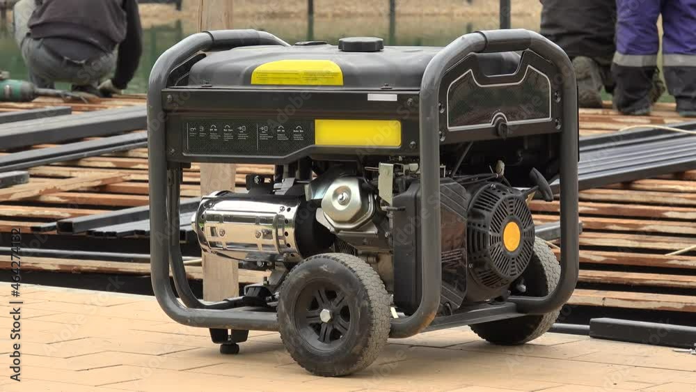 Mobile electricity  engine-generator working at a construction site.