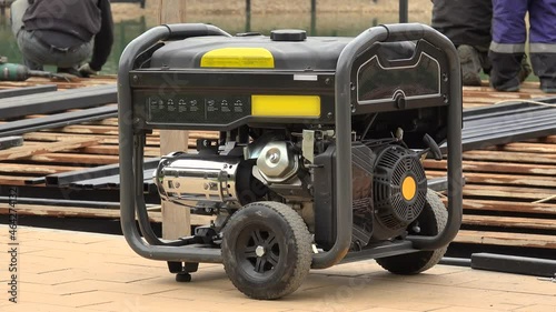Mobile electricity  engine-generator working at a construction site.