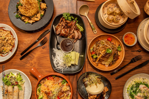 Fotografija set of asian food dishes Pekin duck, noodles, Vietnamese rolls, bao bread, cutle