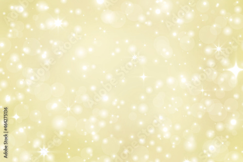 Abstract golden background with stars and bokeh. Christmas festive pattern. Design element.