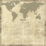 Kalendarz z mapą swiata 2022 rok - język polski - 12 miesięcy - święta i dni wolne zaznaczone innym kolorem.
