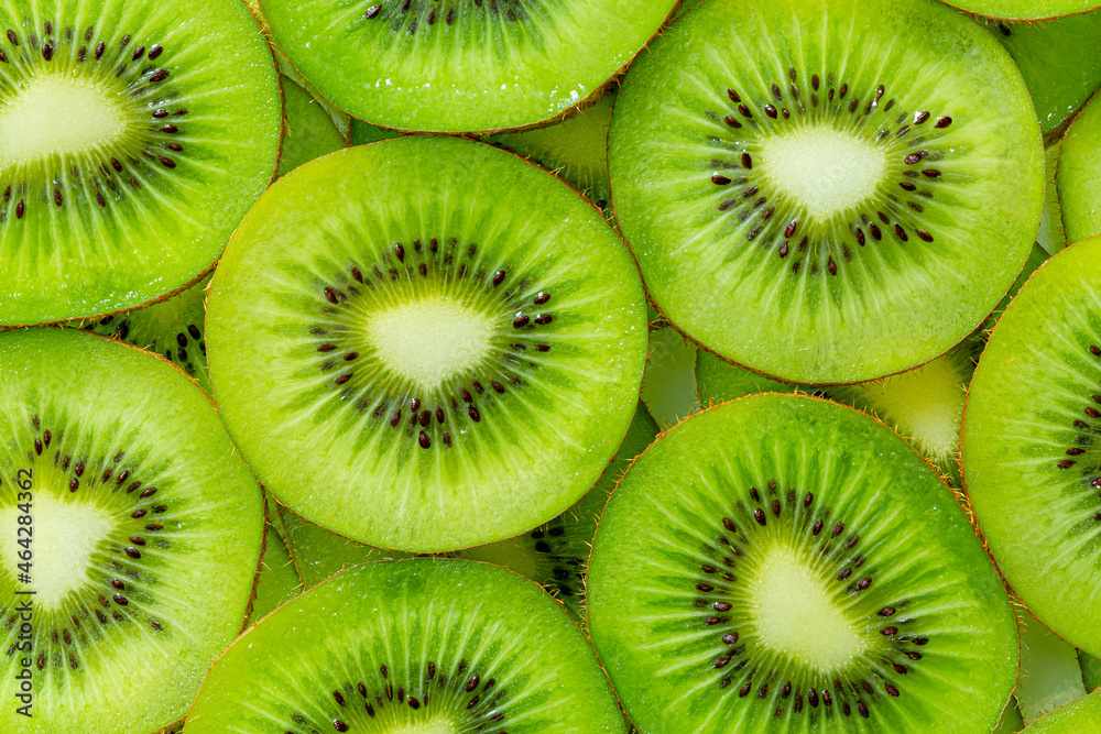 Kiwi Macro,Fresh Kiwi fruit sliced use for background,slice of kiwi fruit on a full frame. horizontal format Kiwi Macro,Fresh Kiwi fruit sliced use for background,slice of kiwi fruit on a full frame. horizontal format