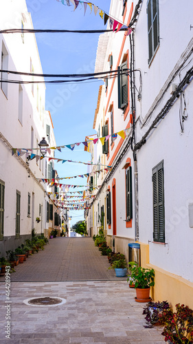 View of the village "Es Migjorn Gran", Menorca, Balearic Islands, Spain, with festoons and plants