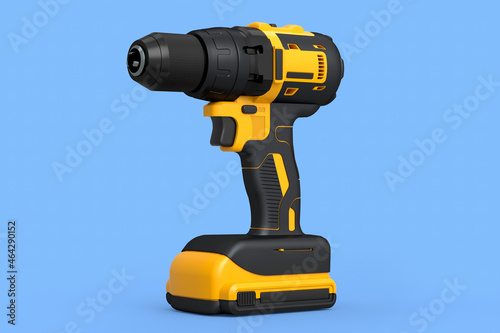 Cordless drill or yellow screwdriver isolated on blue background