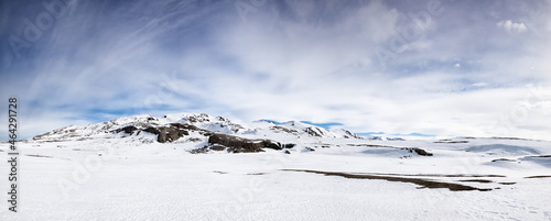 Panorama of the pristine snow-covered mountains of Svalbard