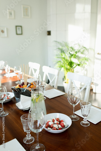 The table set for a buffet table in the Italian style. Caprese, homemade lemonade, © Mikhail