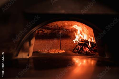 Pizza to be cooked in the oven on a fire © Andrej