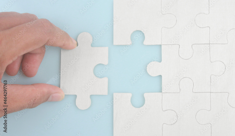Connecting jigsaw puzzle . Business solutions success and strategy concept Connecting jigsaw puzzle . Business solutions success and strategy concept