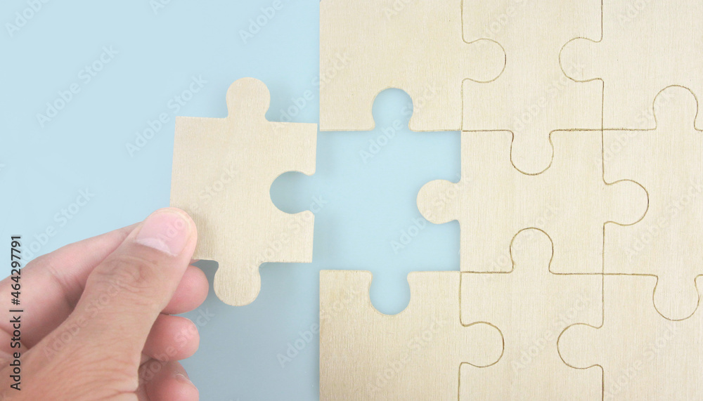 Connecting jigsaw puzzle . Business solutions success and strategy concept Connecting jigsaw puzzle . Business solutions success and strategy concept