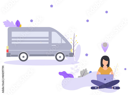 Woman sitting cross-legged, working on laptop computer, location mark and van