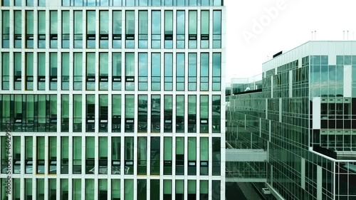 A modern hospital building with large mirrored windows