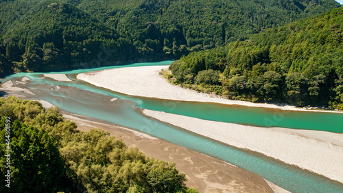 Jade-colored river flowing between the mountains