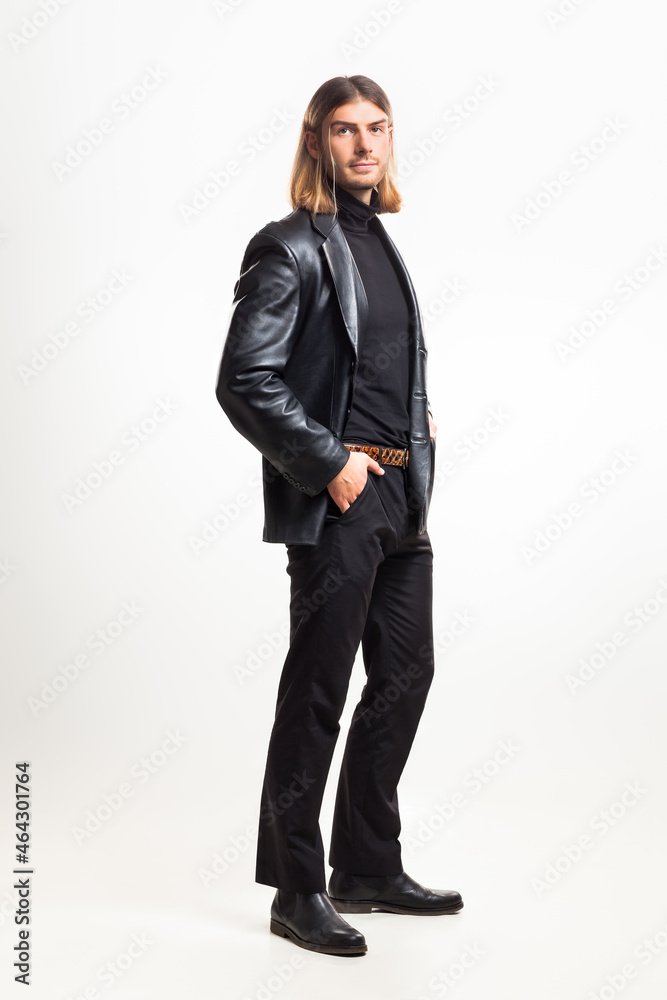 Male fashion, beauty concept. Portrait of young man blond hair, posing over gray background. Classic style. Studio shot Male fashion, beauty concept. Portrait of young man blond hair, posing over gray background. Classic style. Studio shot