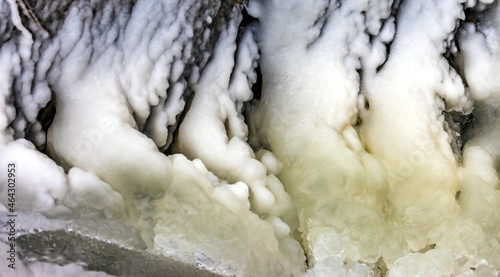 Fast river with ice and snow in late autumn