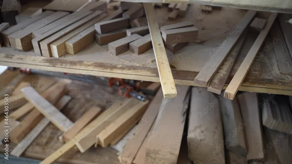 Remnants of wooden planks on shelves in workshop, cut, sawed and polished wooden planks of different sizes ready for woodworking and making furniture or other wooden product Remnants of wooden planks on shelves in workshop, cut, sawed and polished wooden planks of different sizes ready for woodworking and making furniture or other wooden product