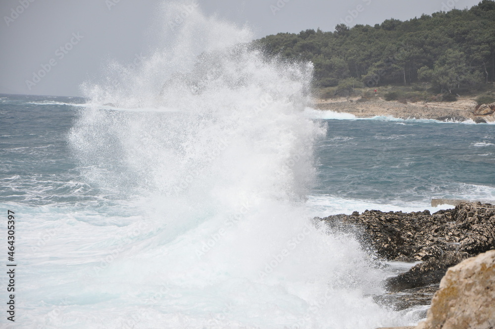 Storm on island coastline with waves and strong wind, Croatia. waves crashing on rocks. Island Losinj.