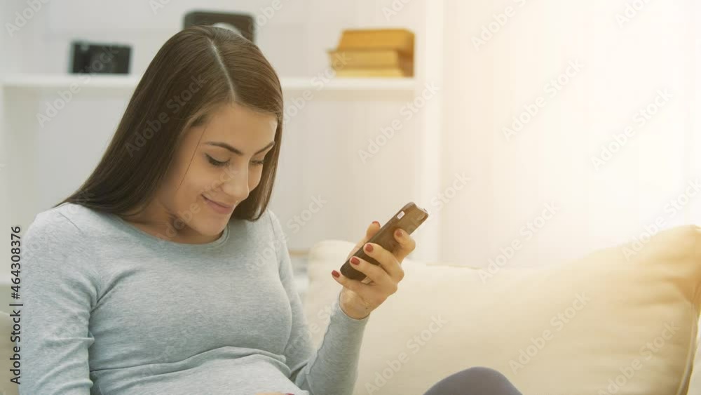 4k video of pregnant woman using phone. 4k video of pregnant woman using phone.