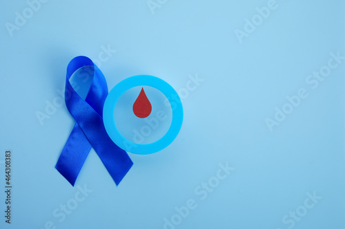 World diabetes day awareness. Blue ribbon and circle with blood drop.