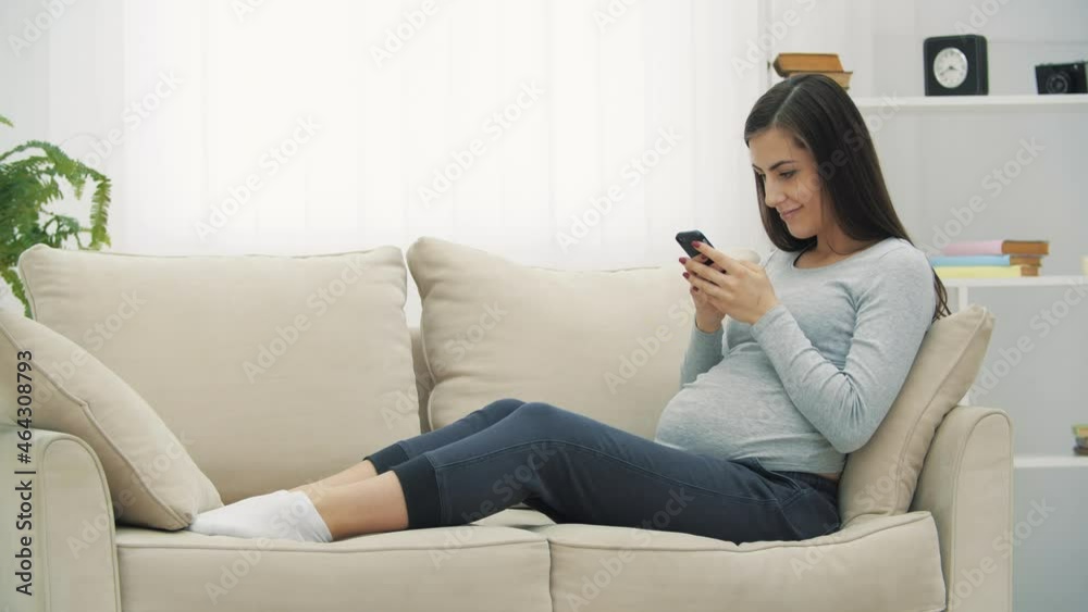 4k video of pregnant woman using phone. 4k video of pregnant woman using phone.