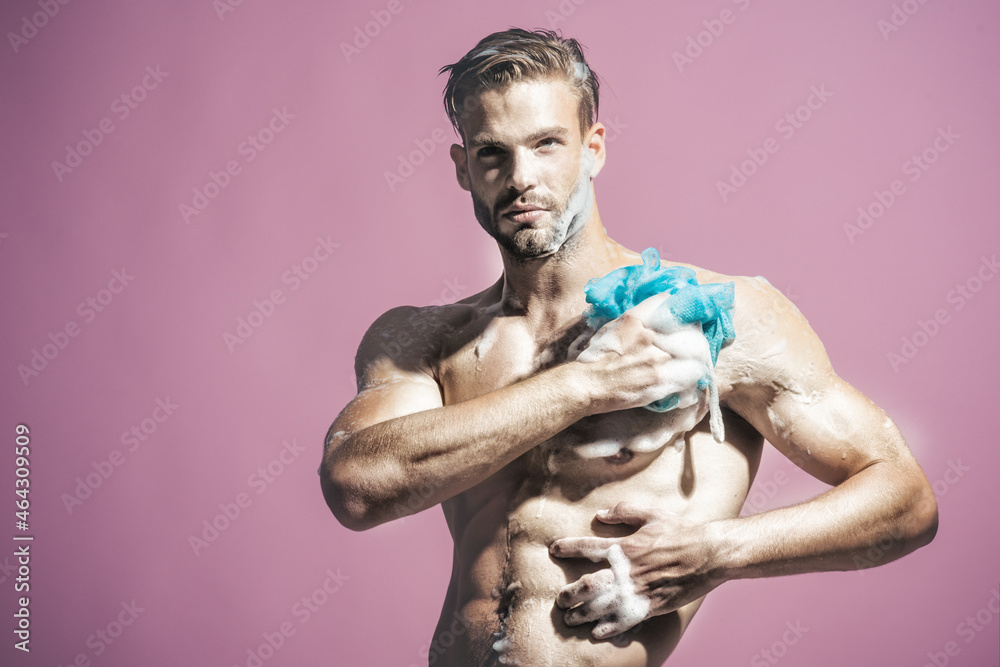 Fitness handsome man taking shower in morning. Muscular fitness bodybuilder taking shower after