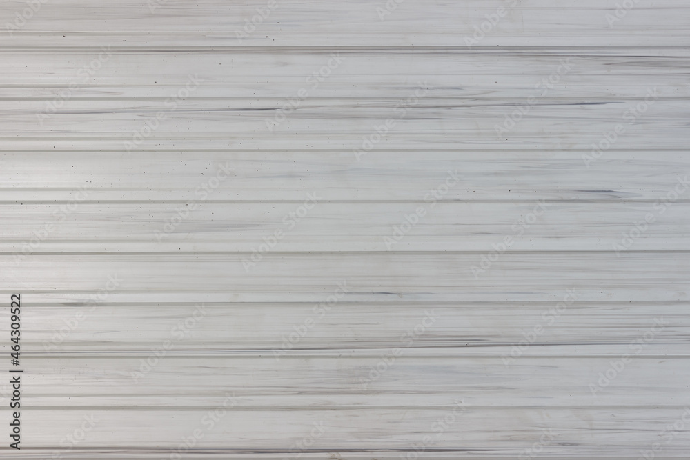 White profiled metal sheet like wooden wall from horizontal planks.
