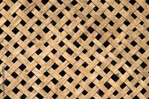 Rustic wooden diagonal lattice. Wood trellis. Wooden netting
