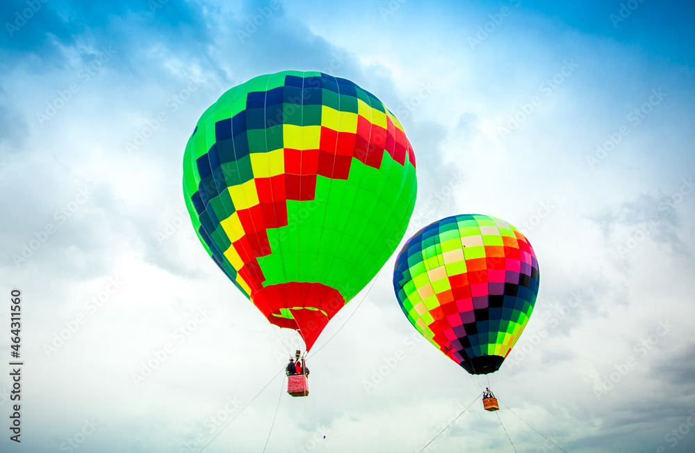 Fototapeta premium Balloon against the blue sky in flight, colorful fun entertaining form of transport, flight in the air of the balloon, the concept of dream and happiness