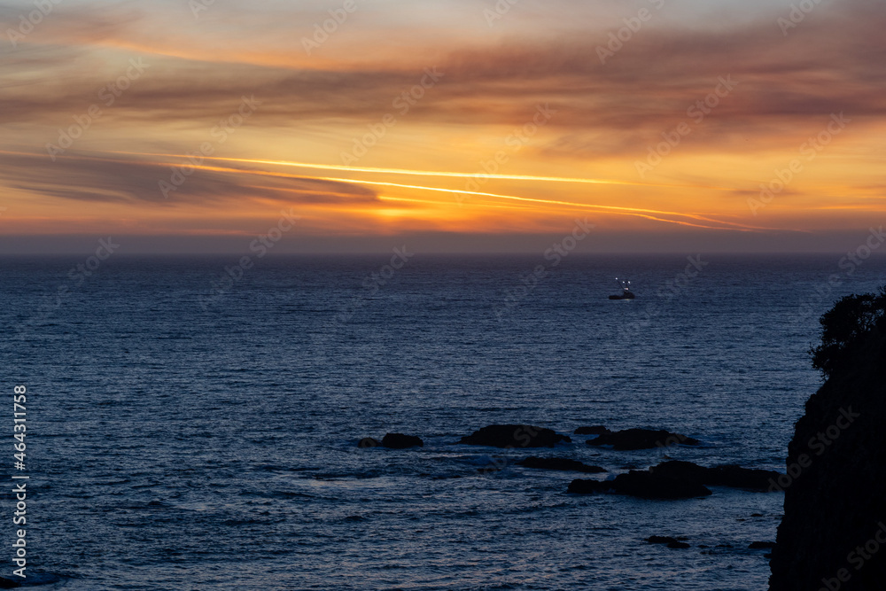 Fototapeta premium Fishing boat at sunset