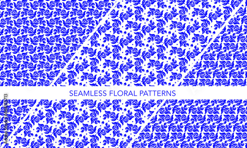 3 different seamless floral pattern design based on the same motif inspired by russian traditional gzhel art.  Blue vector design leaves with berries on white background photo