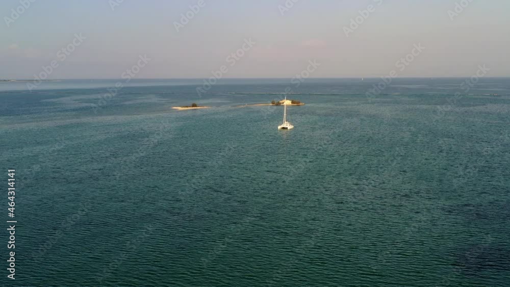 Lagoon with catamaran north of Levkas, Greece Lagoon with catamaran north of Levkas, Greece