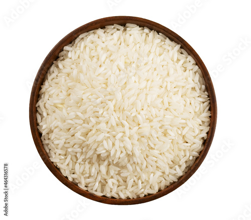 White dry uncooked Rice heap in bowl on white background. Isolate. Top view.
