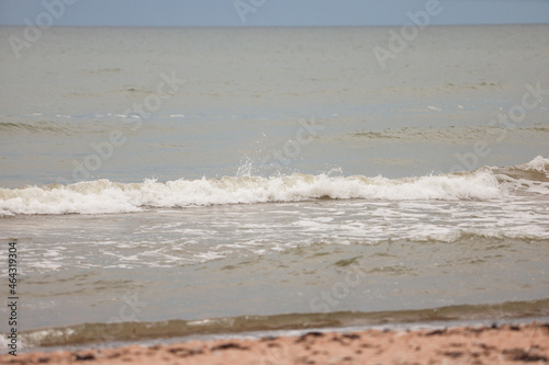 Seascape view of waves in Baltic sea. Photo taken on a warm overcast day.