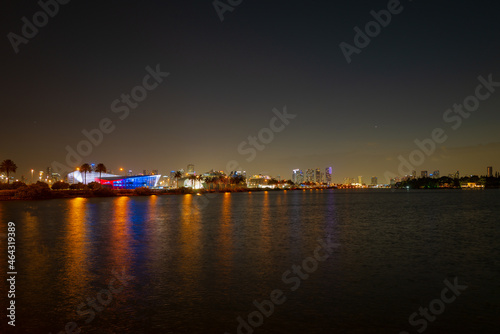 Miami, Florida cityscape skyline on Biscayne Bay. Panorama at dusk with urban skyscrapers and bridge over sea with reflection. © Volodymyr