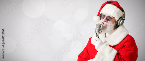 Cool Santa Claus with micro...