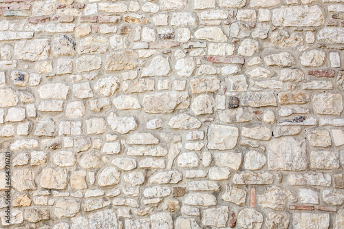 Stampa su tela Stone antique old wall as a background or texture