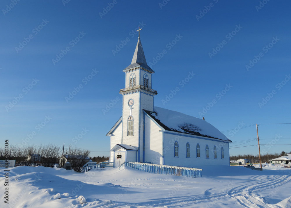 Winter postcard with the church and snow
