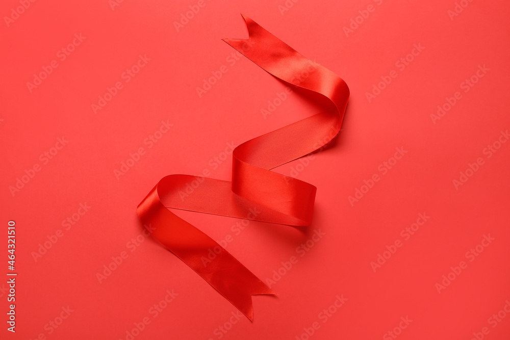 Shiny red ribbon on color background Shiny red ribbon on color background