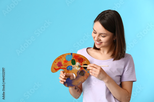 Young female artist with pa...