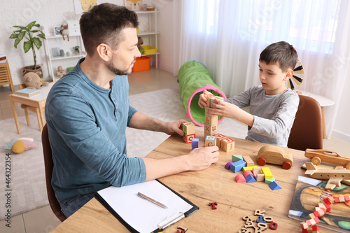 Obraz na plátne Male psychologist working with little boy in office