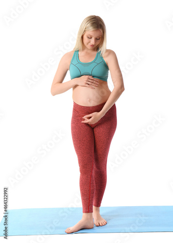 Young pregnant woman doing ...