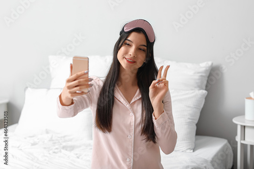 Pretty young woman taking s...